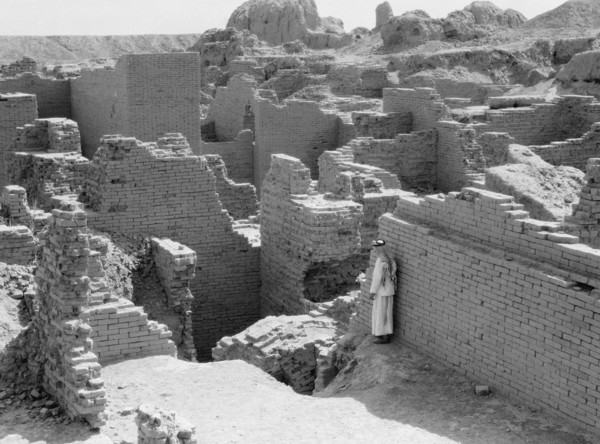 1930s Iraq - Babylon the great. Man standing among the crumbling ruins of Babylon ca. 1932