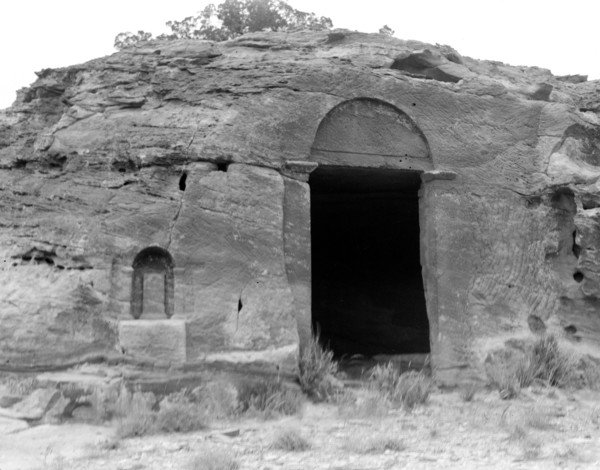 Petra. Wadi-Ed-Der. Doorway near ed-Der. Dushara pillar in niche to left of doorway ca. 1920