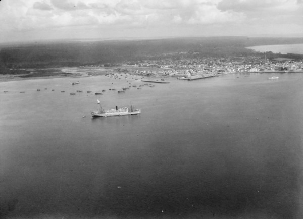 Aerial view of Zanzibar with the H.M.S. Pegasus seen in the port ca. 1936