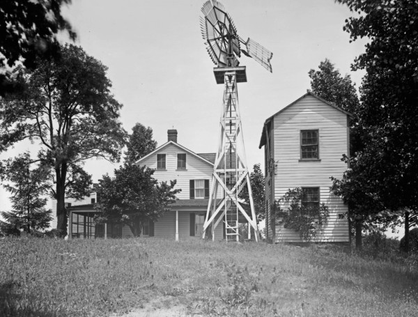 House with windmill. ca.  between 1910 and 1920