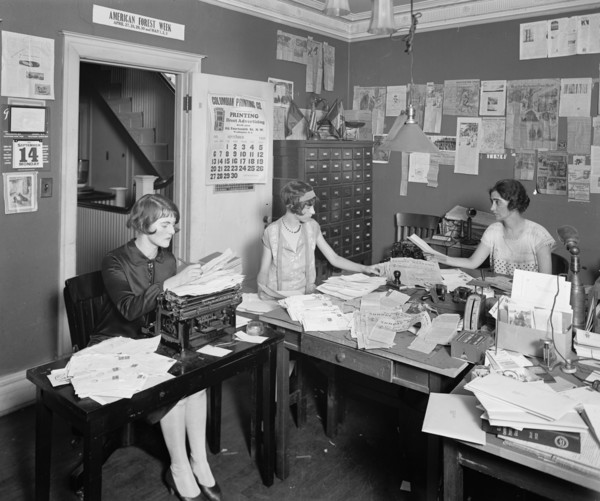 Three women working in the offices of the American Nature Association ca.  between 1910 and 1926
