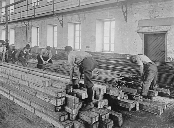 Early 20th century men working with lumber ca.  between 1910 and 1926