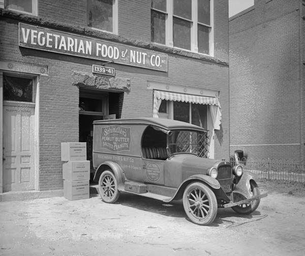 Semmes Motor Company Schindler's Peanut Butter truck parked in front of the Vegetarian Food and Nut Company ca.  between 1910 and 1926
