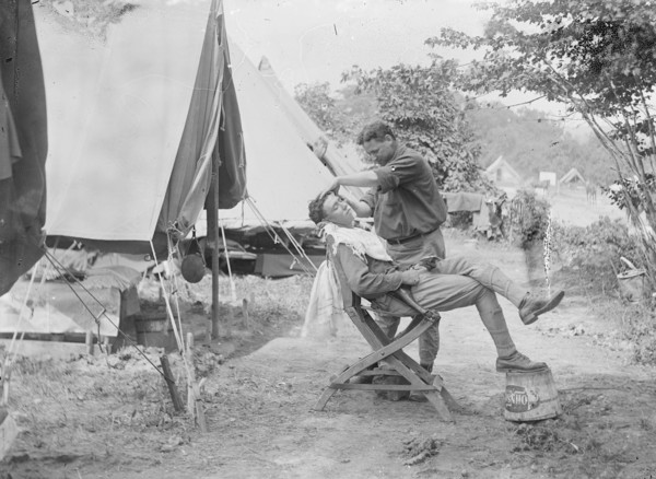 Soldier receiving a shave at a U.S. Army or National Guard camp ca. between 1909 and 1940