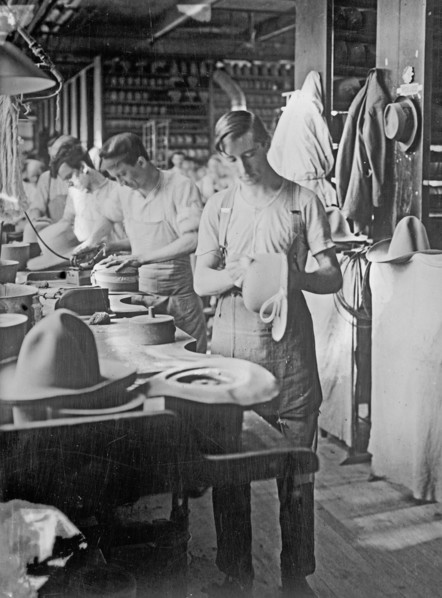 Men working at the Stetson Hat Company manufacturing soft army hats ca. between 1909 and 1920