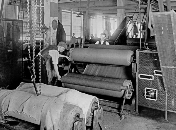 Workers manufacturing of cloth for army uniforms ca. between 1909 and 1920