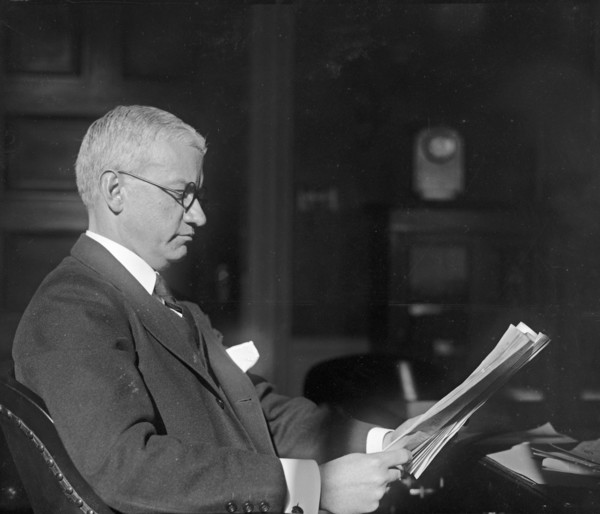 American banker R.C. Leffingwell reading papers ca.  between 1918 and 1920