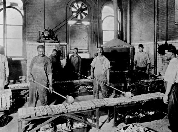 Men pouring melted metal into molds in the Government Printing Office, Washington, D.C. ca. [between 1909 and 1932]