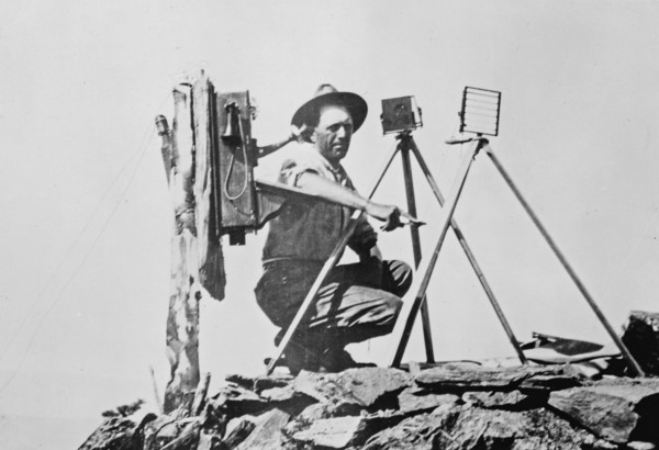 Signal station in the Rockies, showing telephone installation and signal man using heliograph ca. 1909