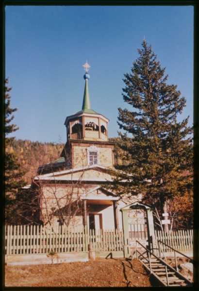 Log Church of Saint Nicholas (1846), west view which was originally built near the site where Lake Baikal drains into the Angara River, Listvianka, Russia; 1999