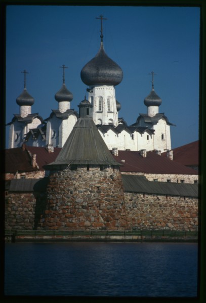 Monastery, Cathedral of the Transfiguration of the Savior (1558-1566), Priadil'naia (Spinning) Tower (late 16th century), southwest view across Bay of Felicity, Solovetskii Island, Russia; 1999