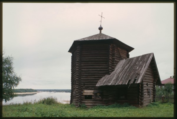 Log Church of the Epiphany (also known as Nativity of the Virgin), (1617), northwest view, with Kama River in background, Pianteg, Russia; 2000