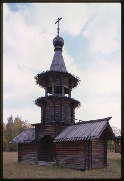 Log Church of the Savior from the village of Zashiversk (1700), bell tower, northeast view, moved and reassembled in the Outdoor Architecture and History Museum at Akademgorodok, Russia 1999.