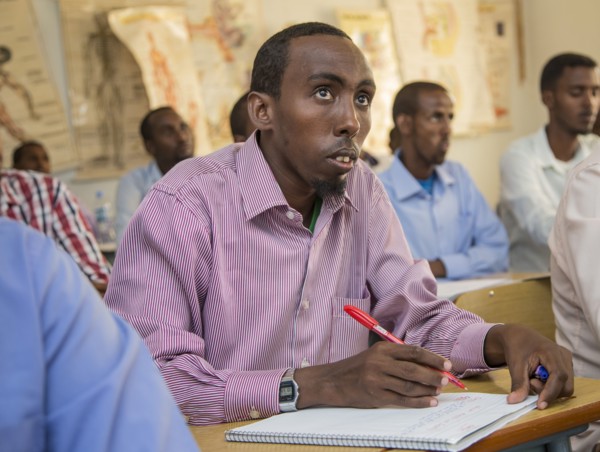 A man listens intently during a teacher training session in Mogadishu or Garowe via the "Somali Youth Learners Initiative (SYLI)"  ca. 11 June 2015