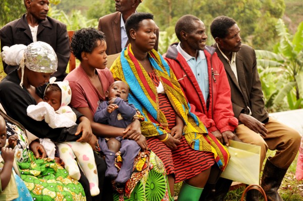 Karrowa Village members listen during a community group meeting discussion on key nutrition and WASH behaviors (Uganda) ca. 13 March 2018