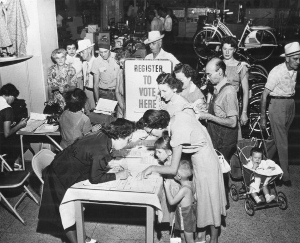 Lining up at a registration booth at Sears Roebuck store