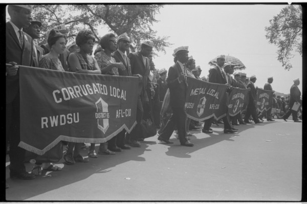 Marchers carrying labor union banners, 1963