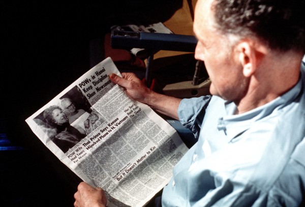 Phillip Manhard reads a Stars and Stripes newspaper