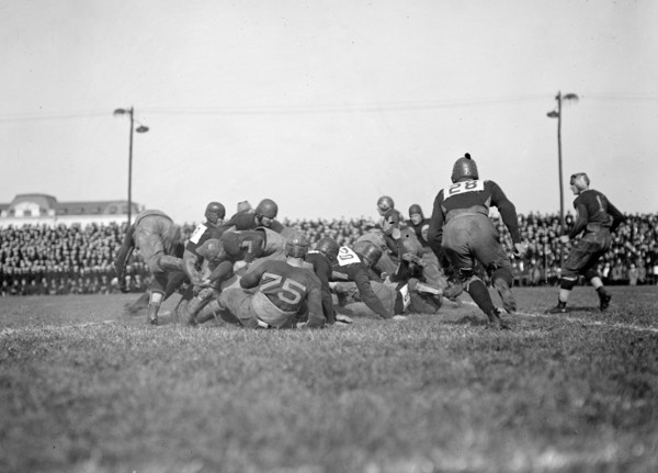 Early 1900s football game in action