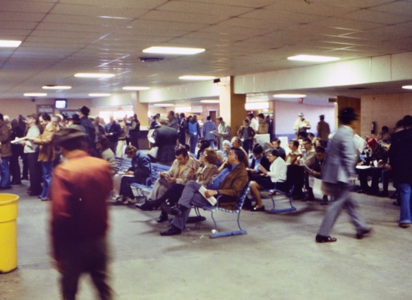 Horse race fans placing bets