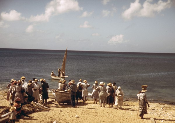 Housewives at the seashore waiting for the fishing boats to come in