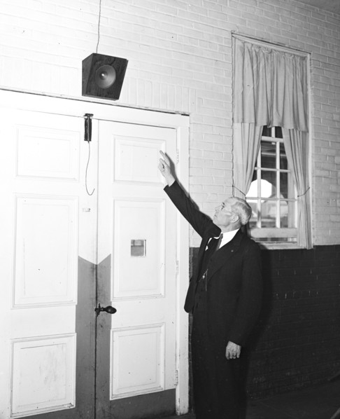 Man pointing to a speaker system