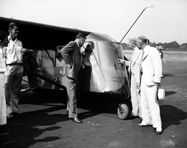 People examining the Waterman Arrowplane
