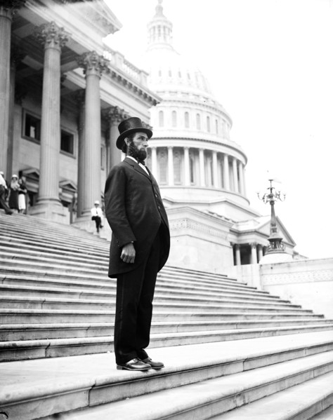 Person dressed as Abraham Lincoln on steps of U.S. Capitol