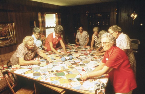 Senior citizens work hard on making a quilt in New Ulm