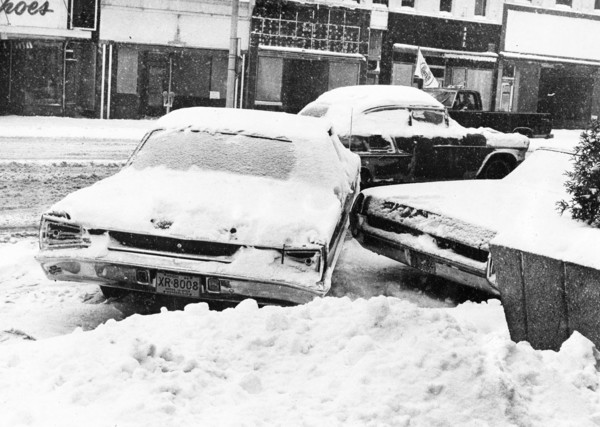 Snowbound Car Stuck Sideways on Street