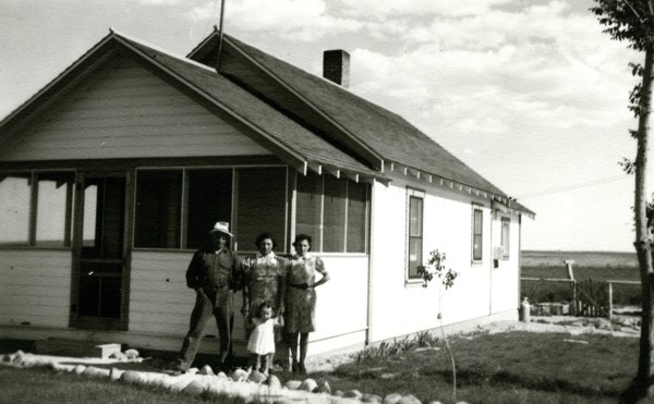 Family in front of house