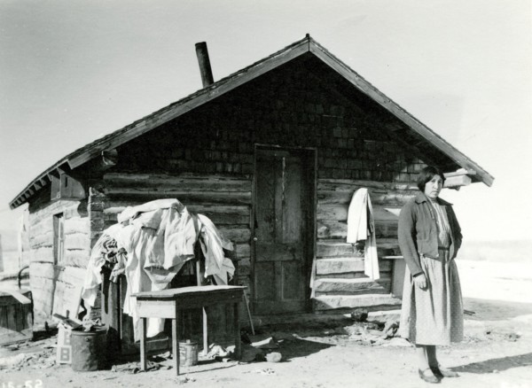 Woman in Front of Cabin