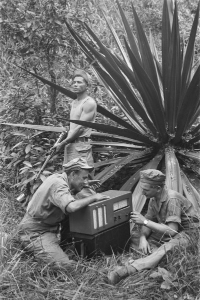Indonesia History - 'Jungleradio'. Soldiers working on a field radio; Date December 1946; Location Indonesia, Dutch East Indies