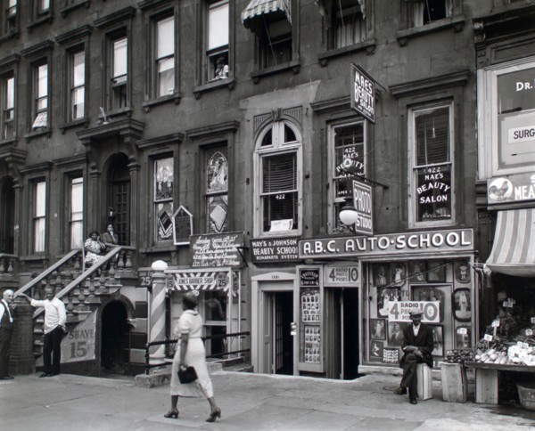 Woman walking in Harlem New York 422-424 Lenox Avenue, Manhattan ca. 1938