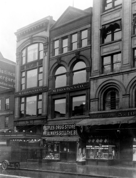 Exterior of People's Drug Store, 11th and G Streets, Washington, D.C., with other shops ca. 1909-1932