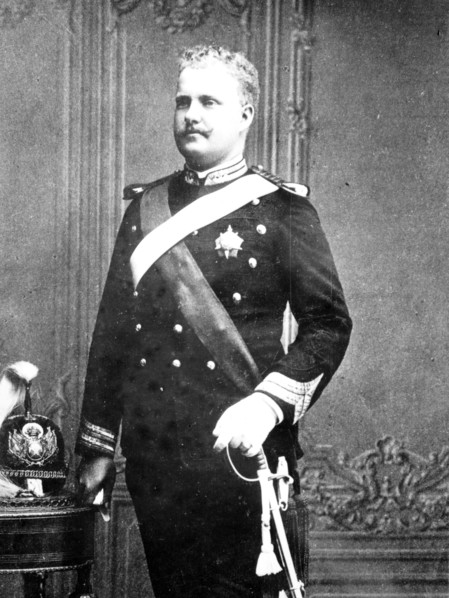 Late King of Portugal as young man, standing in uniforn