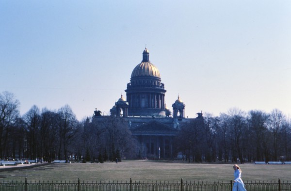 Woman walking outside a building in 1970s Russia (ca. 1978)
