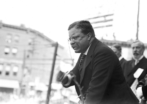 Theodore Roosevelt speaking, gesticulating with fist, outside, Yonkers, NY 1910