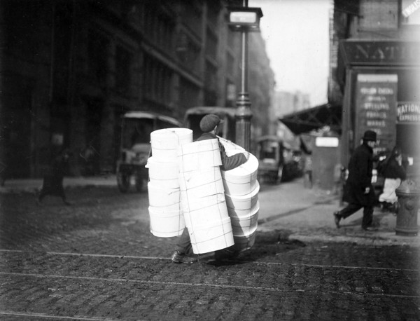 Boy carrying hats. New York City, February 1912