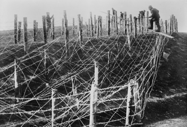 German soldiers fixing a barbed wire entanglement during World War I ca. 1914-1915