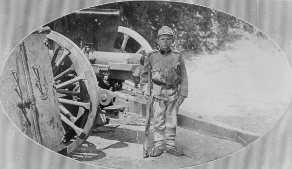 Serbian child soldier in uniform during World War I ca. 1914-1915