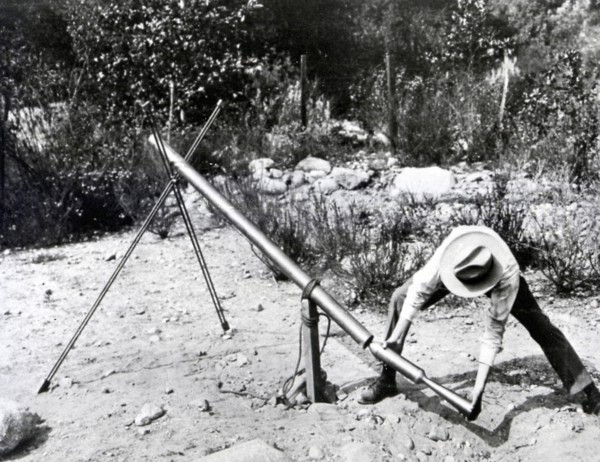Dr. Robert H. Goddard loading a 1918 version of the Bazooka of World War II.