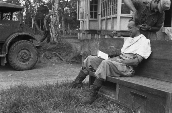 Dutch officer receiving a haircut in Dutch East Indies, Indonesia ca. 1948