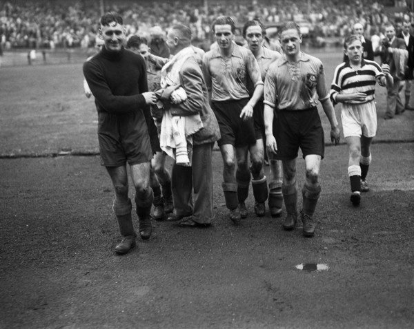 September 21, 1947 - Soccer players leaving the field after a match