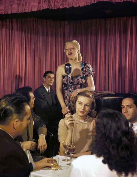 Woman signing at a jazz night club ca. 1948