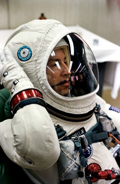 Astronaut James A. Lovell Jr., pilot of the Gemini-7 spaceflight, relaxes in the suiting up trailer at Launch Complex 16, during the Gemini-7 prelaunch countdown