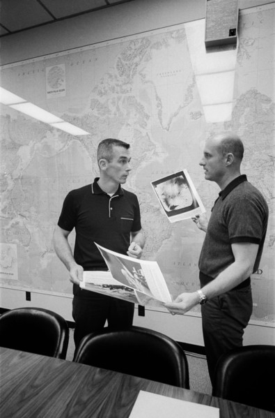 (2 June 1966) Astronauts Thomas P. Stafford (right) and Eugene A. Cernan look over pictures of the lunar surface taken by Surveyor I.