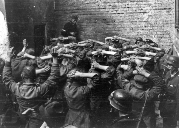 Warsaw Uprising: German POW’s taken in PAST-a building in a courtyard of a townhouse on Zielna street ca. August 1944