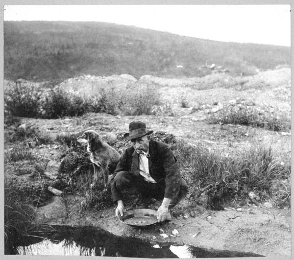 Miner panning gold 1916