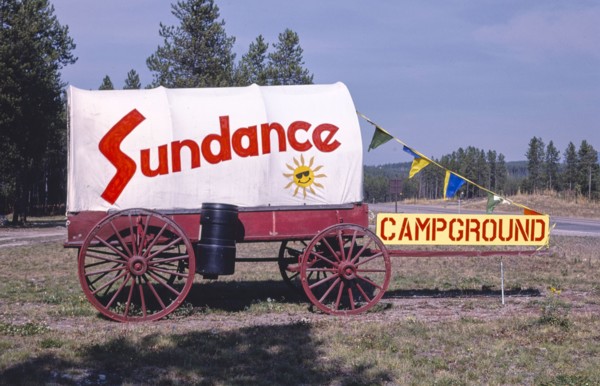 1980s United States -  Sundance Camp Ground sign and Wagon, Route 2, Coram, Montana 1987